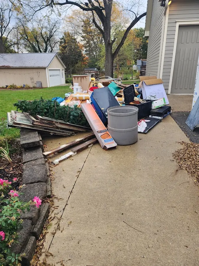 Dumpster being loaded with debris for 30 Yard Dumpster Rental in Medulla